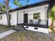 Quaint front porch with decorative iron railings, offering a welcoming entryway to this lovely home at 2322 21St S St, St Petersburg, FL 33712