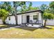 Charming front porch with black railings and a welcoming seating area at 2322 21St S St, St Petersburg, FL 33712
