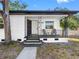 Charming front porch with secure electronic lock, black handrails, and updated front door at 2322 21St S St, St Petersburg, FL 33712