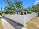 Charming single-story home featuring a well-maintained front yard and a classic white picket fence at 2322 21St S St, St Petersburg, FL 33712