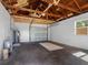Spacious garage featuring exposed wood rafters, water heater and room for 2 cars at 2322 21St S St, St Petersburg, FL 33712