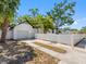 The long drive leads to the two car detached garage with a white privacy fence at 2322 21St S St, St Petersburg, FL 33712