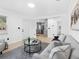 Bright living room with a view into the updated kitchen and adjacent spaces at 2322 21St S St, St Petersburg, FL 33712