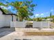 Driveway and yard with secure white fencing and manicured lawn at 2322 21St S St, St Petersburg, FL 33712