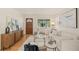 Bright living room with a mix of modern and traditional decor and light hardwood floors at 2410 E Bougainvillea Ave, Tampa, FL 33612