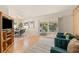 Open-concept living room with dining area and access to a screened outdoor space at 2410 E Bougainvillea Ave, Tampa, FL 33612