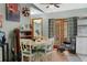 Cozy dining area with a round table, chairs, and lots of natural light coming in from backyard at 2444 Magellan Ave, Spring Hill, FL 34608