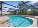 Beautiful pool with screened enclosure and spacious patio, great for backyard fun and relaxation at 2444 Magellan Ave, Spring Hill, FL 34608