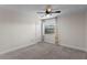 Clean bedroom with carpet, a ceiling fan, a window with curtains, and closet storage at 2513 Buckhorn Run Dr, Valrico, FL 33596