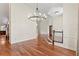 Open dining room with hardwood floors, chandelier, and doorway leading to another room at 2513 Buckhorn Run Dr, Valrico, FL 33596