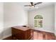 Spacious home office with a large wood desk, natural light, and beautiful hardwood floors at 2513 Buckhorn Run Dr, Valrico, FL 33596