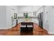 An open concept kitchen features stainless appliances, custom cabinets and granite island at 2513 Buckhorn Run Dr, Valrico, FL 33596