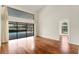Bright living room with high ceilings, hardwood floors and large sliding glass doors to a screened in patio at 2513 Buckhorn Run Dr, Valrico, FL 33596