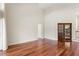 Open living room with hardwood floors, high ceilings, and a doorway leading to another room at 2513 Buckhorn Run Dr, Valrico, FL 33596