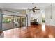 Open concept living area showcases hardwood floors and seamless transition to the kitchen and outdoor spaces at 2513 Buckhorn Run Dr, Valrico, FL 33596