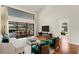 Bright living room with high ceilings, modern furnishings, and large sliding glass doors to an outdoor patio at 2513 Buckhorn Run Dr, Valrico, FL 33596