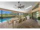 Covered patio with a dining set, grill, and a view of the pool at 2513 Buckhorn Run Dr, Valrico, FL 33596
