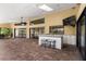 Outdoor kitchen featuring granite counters, bar seating, and a view of the home's exterior at 2513 Buckhorn Run Dr, Valrico, FL 33596