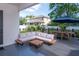 Inviting backyard featuring a wooden deck with outdoor seating and lush landscaping, perfect for entertaining at 2707 W Fig St, Tampa, FL 33609