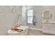 Luxurious bathroom features a freestanding tub, white marble, a large vanity, and modern finishes at 2707 W Fig St, Tampa, FL 33609