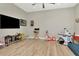 This spacious bonus room provides ample space for children to play and a tv for media enjoyment at 2707 W Fig St, Tampa, FL 33609