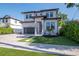 Beautiful two-story home with a modern design and landscaping in the front yard at 2707 W Fig St, Tampa, FL 33609