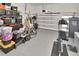 Organized garage space with ample storage, fitness equipment, and room for multiple vehicles, providing functionality and convenience at 2707 W Fig St, Tampa, FL 33609