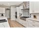 Modern kitchen with stainless steel appliances and custom backsplash, adjacent to the living area at 2707 W Fig St, Tampa, FL 33609
