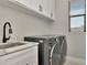 This laundry room includes a sink, counter space, and an LG washer and dryer set at 2707 W Fig St, Tampa, FL 33609