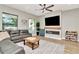Bright living room boasts a fireplace and large windows that provide tons of natural light at 2707 W Fig St, Tampa, FL 33609