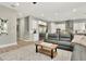 Open concept living room with modern finishes and stainless steel kitchen appliances at 2707 W Fig St, Tampa, FL 33609