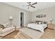 Serene primary bedroom with natural light, neutral tones, and a ceiling fan at 2707 W Fig St, Tampa, FL 33609