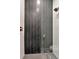A stand-up shower with black and white chevron tile and bronze fixtures is quite attractive at 2707 W Fig St, Tampa, FL 33609