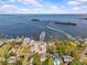 Expansive aerial view of coastal homes, marina, and the bay, perfect for boating and waterfront living at 271 Kayli Ln, Palm Harbor, FL 34683