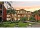 Exterior angle view of a well-maintained lawn and appealing condo complex at 2757 Via Cipriani # 1121B, Clearwater, FL 33764