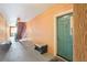 Hallway and stairs leading to a green condo entrance door at 2757 Via Cipriani # 1121B, Clearwater, FL 33764