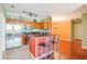 Kitchen boasts bar seating, stainless appliances, and wood cabinetry at 2757 Via Cipriani # 1121B, Clearwater, FL 33764
