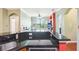 Open living area featuring granite countertops, and an adjacent living room with lots of natural light at 2757 Via Cipriani # 1121B, Clearwater, FL 33764
