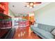 Open-concept living space featuring modern finishes and views of the connected kitchen at 2757 Via Cipriani # 1121B, Clearwater, FL 33764
