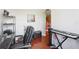 Spacious office area featuring hardwood floors, an electric piano, and functional furniture at 2757 Via Cipriani # 1121B, Clearwater, FL 33764