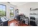 Bright office space with hardwood floors, a large window, and functional furniture at 2757 Via Cipriani # 1121B, Clearwater, FL 33764