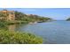Scenic view of waterfront residences with private docks, enhancing the tranquil coastal living experience at 2757 Via Cipriani # 1121B, Clearwater, FL 33764