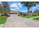 Traditional home with mature trees, well maintained landscaping and a two car garage at 3212 Alcott Ave, Plant City, FL 33566