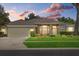 Charming home with well-maintained lawn, mature landscaping, and attached two car garage at 3212 Alcott Ave, Plant City, FL 33566