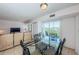 Comfortable dining area that leads into the living room, and opens to the balcony at 3315 58Th S Ave # 509, St Petersburg, FL 33711