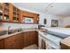 Well-lit kitchen area featuring wood cabinets and stainless steel appliances at 3315 58Th S Ave # 509, St Petersburg, FL 33711