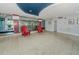 Inviting condo lobby area with sleek floors, modern decor and comfortable red chairs at 3315 58Th S Ave # 509, St Petersburg, FL 33711