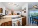 View of Kitchen area with adjacent dining and living areas plus balcony access at 3315 58Th S Ave # 509, St Petersburg, FL 33711