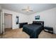 Clean bedroom with black bedroom set, neutral walls, and lighted ceiling fan at 3315 58Th S Ave # 509, St Petersburg, FL 33711