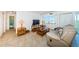 Well-lit living room boasts comfortable seating and access to a private balcony at 3315 58Th S Ave # 509, St Petersburg, FL 33711